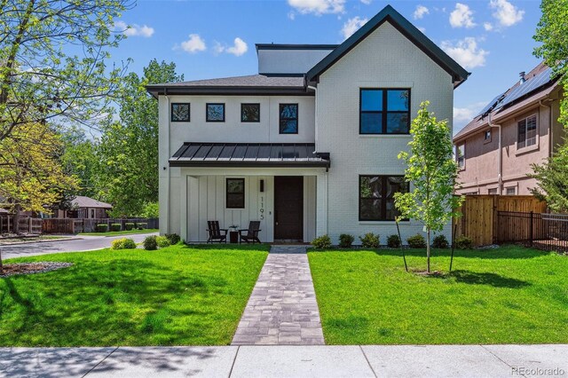 1195 S Milwaukee St, Denver, CO 80210 - modern farmhouse style home featuring a standing seam roof, brick siding, board and batten siding, and metal roof