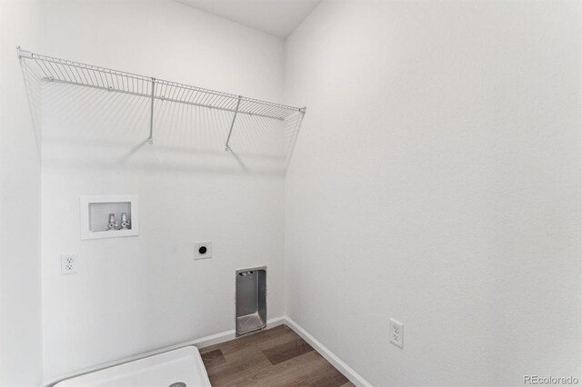 clothes washing area with hookup for a washing machine, wood-type flooring, and hookup for an electric dryer