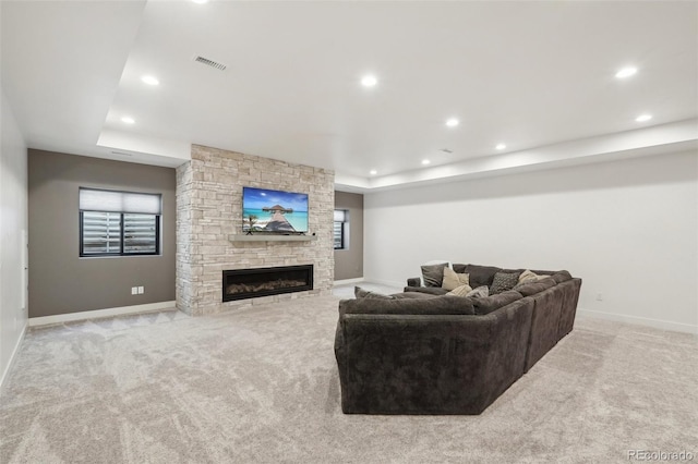 carpeted living room with a fireplace