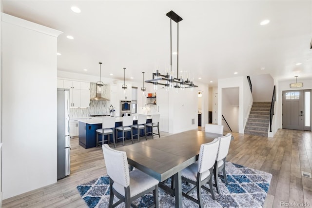 dining space with light wood-type flooring