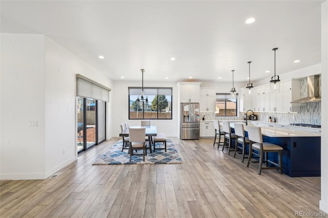 dining space featuring light hardwood / wood-style flooring