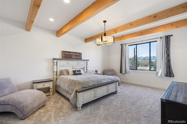 carpeted bedroom featuring beamed ceiling