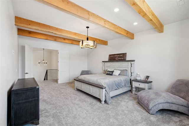 carpeted bedroom with beamed ceiling