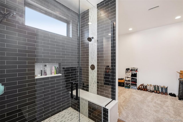 bathroom featuring tiled shower