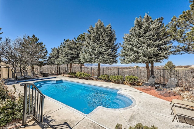 view of swimming pool featuring a patio area, a fenced backyard, and a fenced in pool