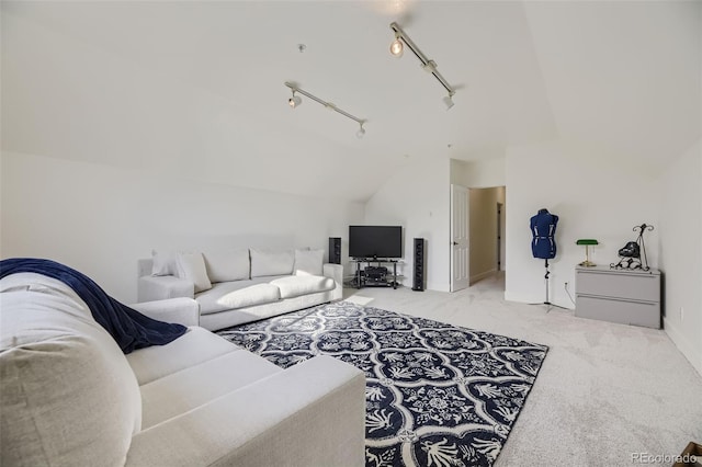 living room featuring carpet flooring and vaulted ceiling