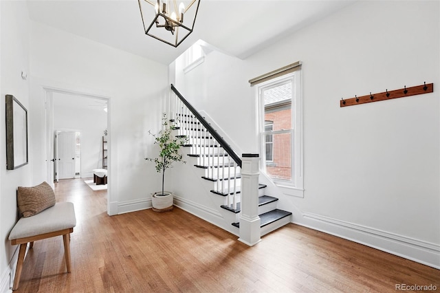 3330 W 30th Ave, Denver, CO 80211 - stairs featuring wood finished floors, a chandelier, and baseboards