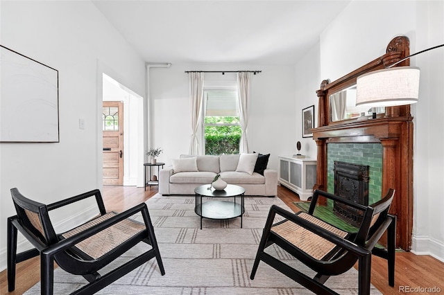 3330 W 30th Ave, Denver, CO 80211 - living area featuring wood finished floors, a fireplace, and baseboards