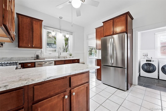 3330 W 30th Ave, Denver, CO 80211 - kitchen with appliances with stainless steel finishes, independent washer and dryer, ceiling fan, a sink, and light stone countertops