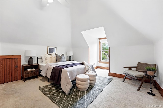 3330 W 30th Ave, Denver, CO 80211 - bedroom with light colored carpet, vaulted ceiling, baseboards, and a ceiling fan