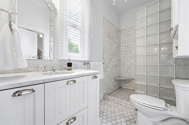 3330 W 30th Ave, Denver, CO 80211 - full bath featuring toilet, tiled shower, vanity, crown molding, and tile patterned floors