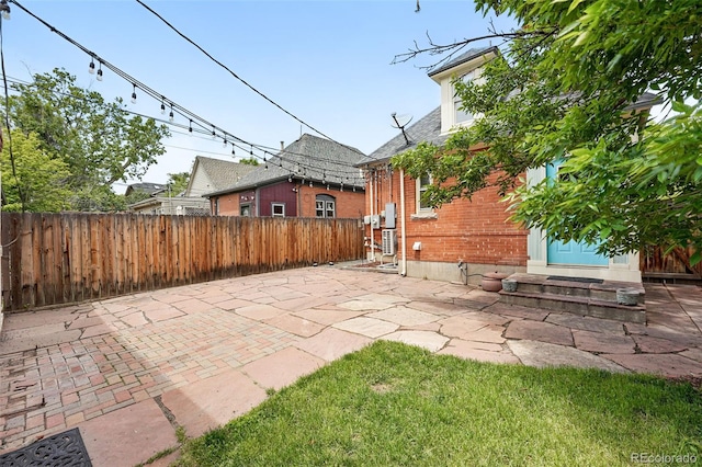 3330 W 30th Ave, Denver, CO 80211 - fenced backyard with entry steps and a patio area