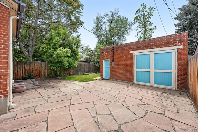 3330 W 30th Ave, Denver, CO 80211 - fenced backyard featuring a patio and an outbuilding