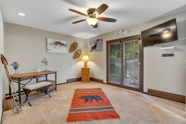 interior space featuring a baseboard heating unit, carpet, and ceiling fan