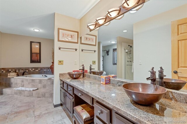 bathroom with shower with separate bathtub, tile patterned flooring, and dual bowl vanity