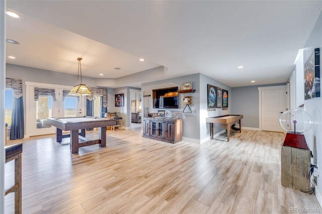 game room featuring light hardwood / wood-style flooring, french doors, and pool table