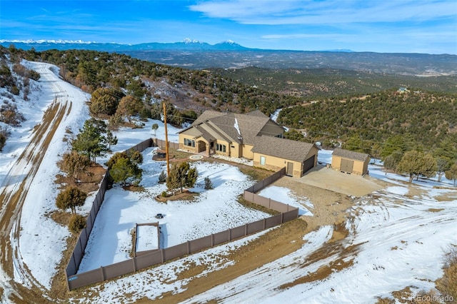 snowy aerial view with a mountain view