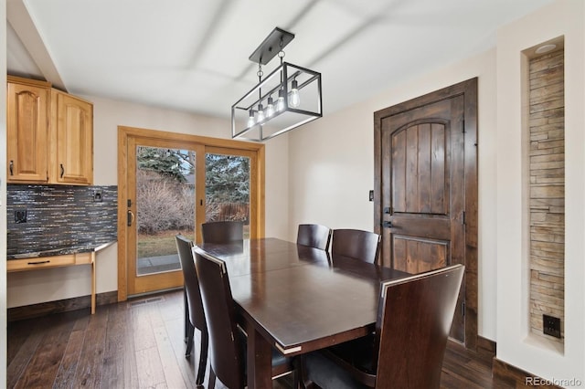 dining space featuring dark hardwood / wood-style flooring