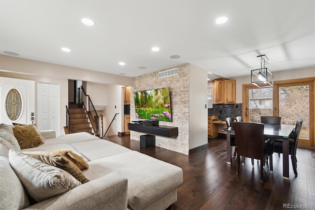 living room featuring dark wood-type flooring