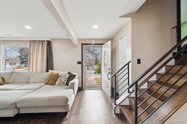 foyer entrance featuring a wealth of natural light and dark hardwood / wood-style floors