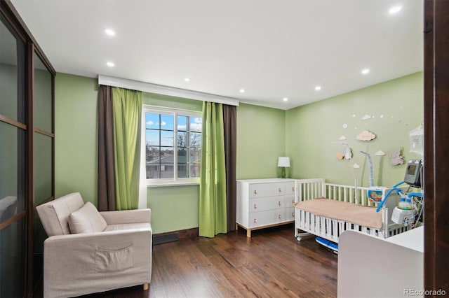 bedroom featuring dark hardwood / wood-style floors