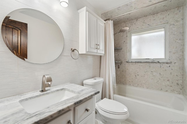 full bathroom featuring toilet, vanity, tile walls, decorative backsplash, and shower / tub combo with curtain