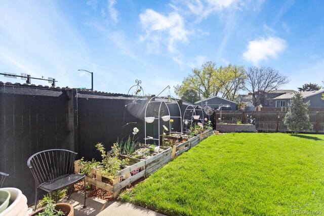 10405 W 107th Pl, Broomfield, CO 80021 - view of yard featuring a vegetable garden