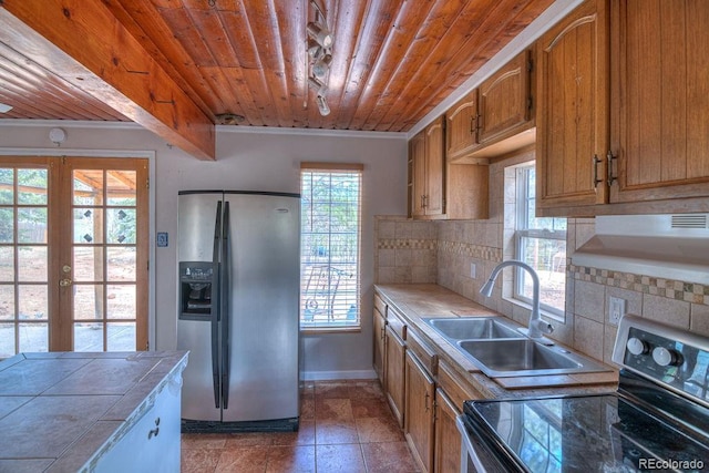 11 Hupp Rd, Bailey, CO 80421 - kitchen with tile counters, tasteful backsplash, stainless steel appliances, wood ceiling, and a sink