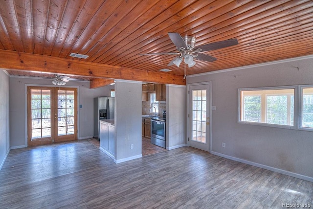 11 Hupp Rd, Bailey, CO 80421 - unfurnished living room with wood ceiling, beamed ceiling, visible vents, a ceiling fan, and wood finished floors