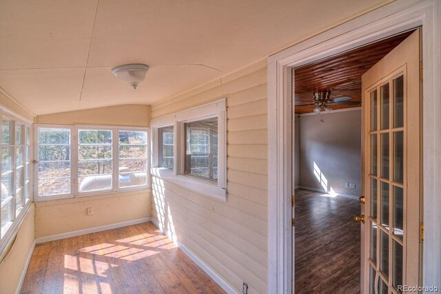 11 Hupp Rd, Bailey, CO 80421 - unfurnished sunroom featuring baseboards, lofted ceiling, and wood finished floors