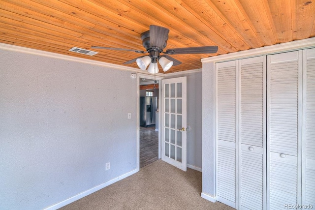 11 Hupp Rd, Bailey, CO 80421 - unfurnished bedroom featuring visible vents, wooden ceiling, carpet, and stainless steel refrigerator with ice dispenser