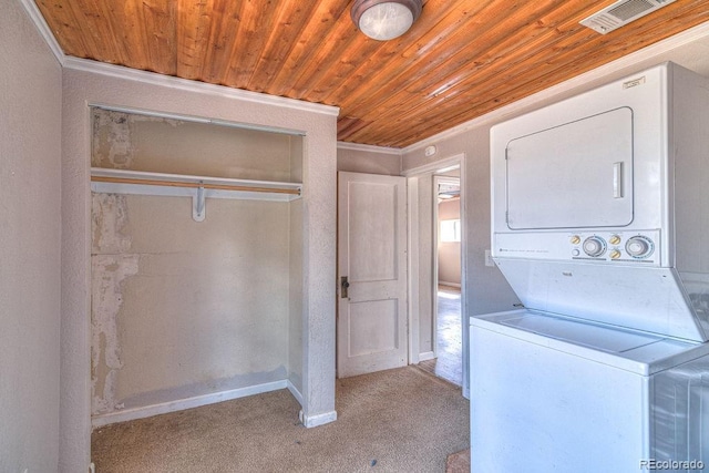 11 Hupp Rd, Bailey, CO 80421 - clothes washing area with carpet flooring, stacked washer and clothes dryer, wood ceiling, and visible vents