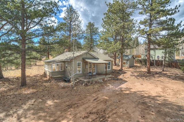 11 Hupp Rd, Bailey, CO 80421 - rear view of house with a patio, fence, an outdoor structure, and entry steps