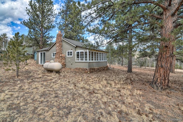 11 Hupp Rd, Bailey, CO 80421 - view of home's exterior with a chimney