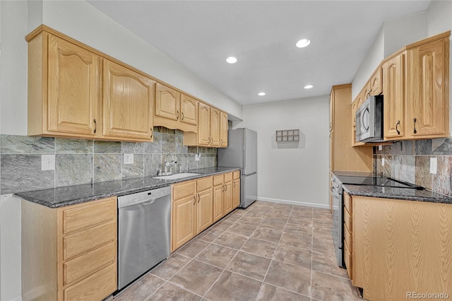 3463 W Bowles Ave, Littleton, CO 80123 - kitchen featuring appliances with stainless steel finishes, dark stone counters, recessed lighting, decorative backsplash, and light brown cabinets