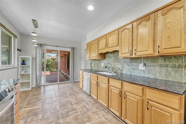 3463 W Bowles Ave, Littleton, CO 80123 - kitchen with appliances with stainless steel finishes, tasteful backsplash, dark stone countertops, a textured ceiling, and pendant lighting