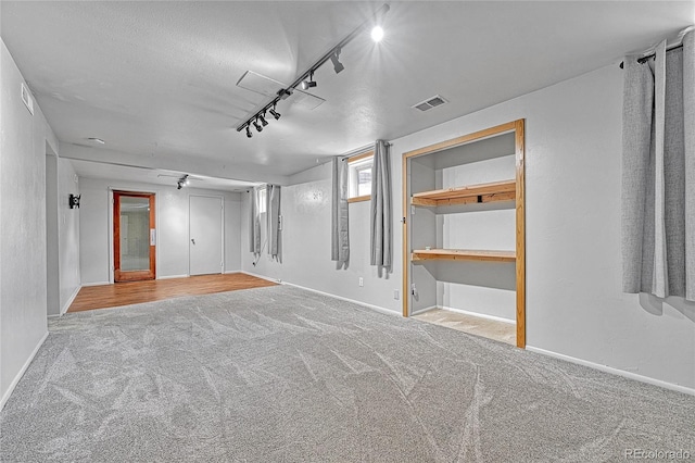 3463 W Bowles Ave, Littleton, CO 80123 - empty room featuring carpet flooring and rail lighting