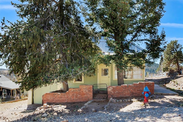 view of property hidden behind natural elements