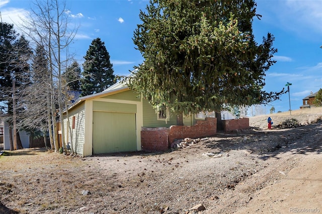 view of side of home featuring a garage