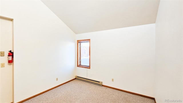 unfurnished room with carpet, vaulted ceiling, and a baseboard radiator