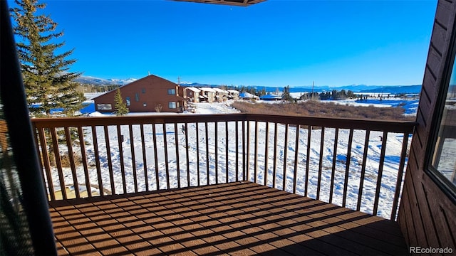 view of snow covered deck