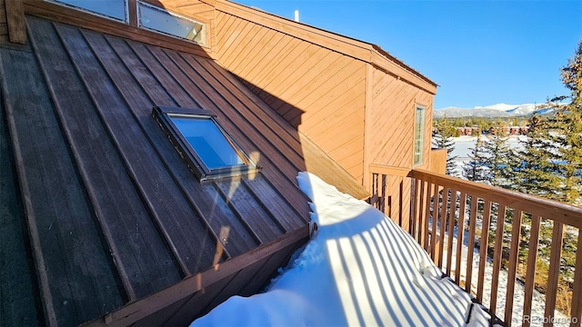 view of snowy exterior with a mountain view