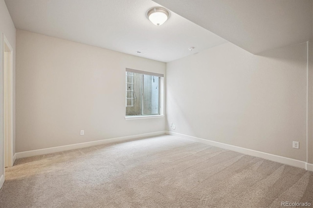 2264 S Joyce St, Lakewood, CO 80228 - carpeted spare room featuring baseboards