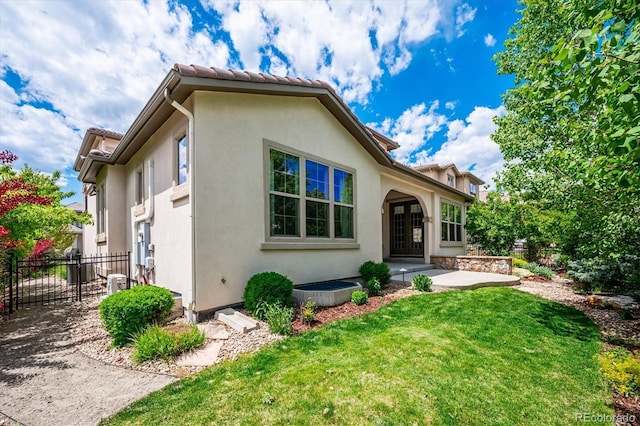 2264 S Joyce St, Lakewood, CO 80228 - view of front of home featuring stucco siding