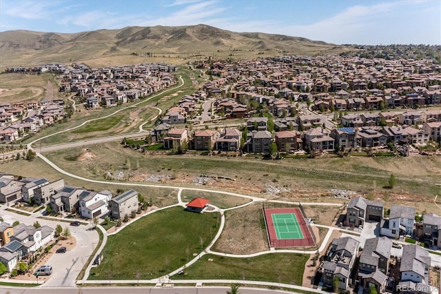 2264 S Joyce St, Lakewood, CO 80228 - aerial view of property and surrounding area featuring nearby suburban area and a mountainous background