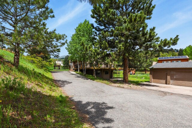 30221 Stagecoach Blvd, Evergreen, CO 80439 - view of front of property with a wooden deck