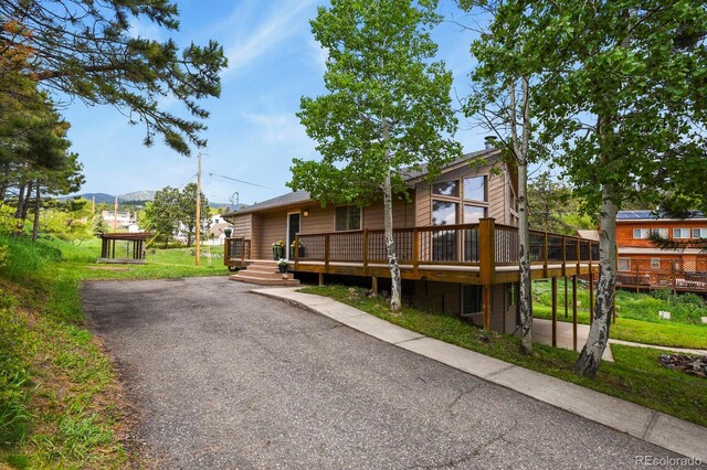 30221 Stagecoach Blvd, Evergreen, CO 80439 - view of front of home with a deck and asphalt driveway