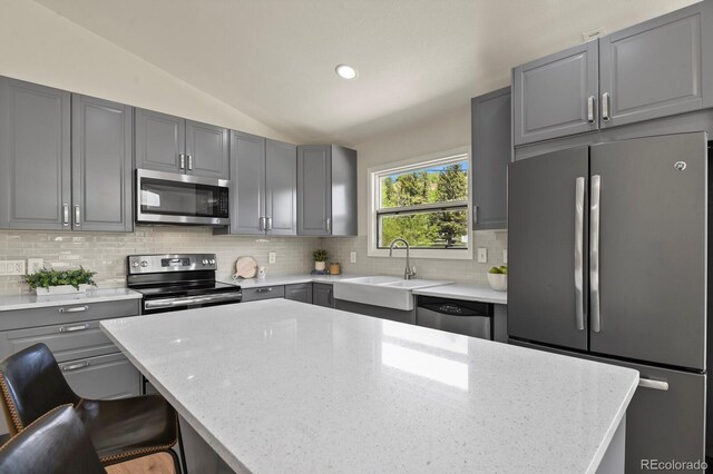 30221 Stagecoach Blvd, Evergreen, CO 80439 - kitchen with stainless steel appliances, gray cabinets, a sink, lofted ceiling, and recessed lighting