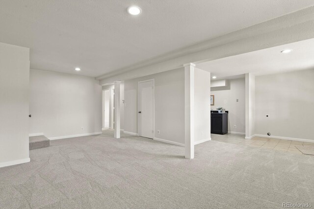30221 Stagecoach Blvd, Evergreen, CO 80439 - basement featuring light colored carpet, recessed lighting, and baseboards