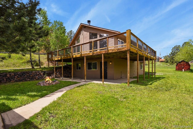 30221 Stagecoach Blvd, Evergreen, CO 80439 - back of property with an outdoor fire pit, a patio, a deck, and a yard